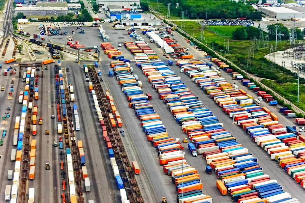 An aerial view of the CSX intermodal terminal at Bedford Park, Illinois, showing long parallel rows of containers parked on chassis between the running tracks.